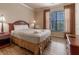 Bedroom with double bed, wood floors and ample light at 1351 Tuscan Ter # 8401, Davenport, FL 33896