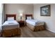 Bedroom with two twin beds and wood flooring at 1351 Tuscan Ter # 8401, Davenport, FL 33896