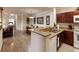 Kitchen features granite countertops and dark wood cabinets at 1351 Tuscan Ter # 8401, Davenport, FL 33896