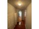 Hallway with light walls and tiled floor leading to archway at 13560 Turtle Marsh Loop # 319, Orlando, FL 32837