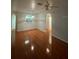 Spacious living room featuring wood-look flooring and recessed lighting at 13560 Turtle Marsh Loop # 319, Orlando, FL 32837