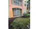 Cozy screened porch with ample space for outdoor seating overlooking the well manicured lawn at 13560 Turtle Marsh Loop # 319, Orlando, FL 32837