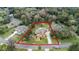 Aerial view of a single-Gathering home with a large lot and mature trees at 1437 Pecos Dr, Ormond Beach, FL 32174