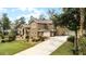 Two-story house with attached garage and a landscaped yard at 1437 Pecos Dr, Ormond Beach, FL 32174