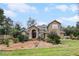 Two-story house with a landscaped yard and walkway to entrance at 1437 Pecos Dr, Ormond Beach, FL 32174