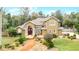Two-story house with landscaped yard and walkway at 1437 Pecos Dr, Ormond Beach, FL 32174