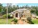Two-story house with landscaped yard and walkway at 1437 Pecos Dr, Ormond Beach, FL 32174