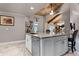 Island kitchen with granite countertops and stainless steel appliances at 1437 Pecos Dr, Ormond Beach, FL 32174