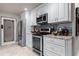 Modern kitchen with stainless steel appliances and dark-colored backsplash at 1437 Pecos Dr, Ormond Beach, FL 32174