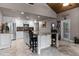 Open kitchen with island, granite countertops, and stainless steel appliances at 1437 Pecos Dr, Ormond Beach, FL 32174