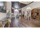 Elegant living room with hardwood floors, decorative ceiling, and fireplace at 1437 Pecos Dr, Ormond Beach, FL 32174