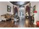 Living room with hardwood floors, fireplace, and access to backyard at 1437 Pecos Dr, Ormond Beach, FL 32174