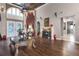 Spacious living room with hardwood floors, fireplace, and large windows at 1437 Pecos Dr, Ormond Beach, FL 32174