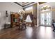 Spacious living room with hardwood floors, a fireplace, and large windows at 1437 Pecos Dr, Ormond Beach, FL 32174