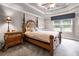 Spacious bedroom with a large bed, nightstand, and ample natural light at 1437 Pecos Dr, Ormond Beach, FL 32174