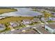 Community view showcasing desirable homes near a lake at 16750 Sanctuary Dr, Winter Garden, FL 34787