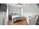 Cozy bedroom with a comfortable seating area and calming decor at 16750 Sanctuary Dr, Winter Garden, FL 34787