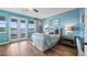 Light and airy bedroom with water views and access to balcony at 16750 Sanctuary Dr, Winter Garden, FL 34787