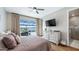 Main bedroom with lake views, private access to the pool, and ensuite bathroom at 16750 Sanctuary Dr, Winter Garden, FL 34787