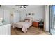 Bright bedroom with a comfortable bed, built-in workspace, and plenty of closet space at 16750 Sanctuary Dr, Winter Garden, FL 34787