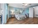 Serene bedroom with light blue walls and wood flooring at 16750 Sanctuary Dr, Winter Garden, FL 34787