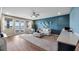 Cozy bonus room with lake views, comfortable seating, and a wet bar at 16750 Sanctuary Dr, Winter Garden, FL 34787