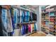 Large walk-in closet with custom shelving and storage at 16750 Sanctuary Dr, Winter Garden, FL 34787