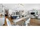 Kitchen dining area with seating and view into Gathering room at 16750 Sanctuary Dr, Winter Garden, FL 34787