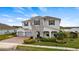 Two-story home with stone accents and a landscaped yard at 16750 Sanctuary Dr, Winter Garden, FL 34787
