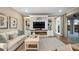 Gathering room with fireplace, built-in shelving, and large TV at 16750 Sanctuary Dr, Winter Garden, FL 34787