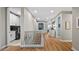 Spacious hallway with hardwood floors and laundry access at 16750 Sanctuary Dr, Winter Garden, FL 34787