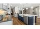 Modern kitchen with island, stainless steel appliances, and white cabinets at 16750 Sanctuary Dr, Winter Garden, FL 34787