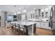Modern kitchen with large island and breakfast area at 16750 Sanctuary Dr, Winter Garden, FL 34787