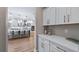 Elegant kitchen with white cabinets, quartz countertops, and an island at 16750 Sanctuary Dr, Winter Garden, FL 34787