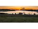 Stunning sunset view over a serene lake and lush landscape at 16750 Sanctuary Dr, Winter Garden, FL 34787