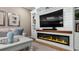 Living room with fireplace and built-in entertainment center at 16750 Sanctuary Dr, Winter Garden, FL 34787