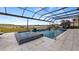 Beautiful pool area with lake view and screened enclosure at 16750 Sanctuary Dr, Winter Garden, FL 34787