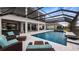 Large pool with covered patio and lake view at 16750 Sanctuary Dr, Winter Garden, FL 34787