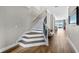 Elegant staircase with wrought-iron railing at 16750 Sanctuary Dr, Winter Garden, FL 34787
