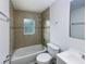 Clean bathroom with a tub shower combination at 1810 Selleen Dr, Eustis, FL 32726