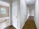 Clean bathroom and hallway with tile flooring and updated fixtures at 1810 Selleen Dr, Eustis, FL 32726