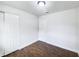 Bedroom featuring dark brown tile floors and a double door closet at 1810 Selleen Dr, Eustis, FL 32726