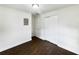 Bedroom with dark brown tile floors and ample closet space at 1810 Selleen Dr, Eustis, FL 32726