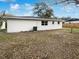 Rear view of the house showcasing the backyard at 1810 Selleen Dr, Eustis, FL 32726