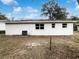 Rear view of the house showcasing the backyard at 1810 Selleen Dr, Eustis, FL 32726