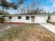 Newly renovated single story home with a landscaped yard at 1810 Selleen Dr, Eustis, FL 32726