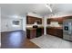 Updated kitchen, featuring dark wood cabinets and granite countertops at 1810 Selleen Dr, Eustis, FL 32726