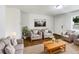 Bright living room featuring hardwood floors and comfy seating at 1810 Selleen Dr, Eustis, FL 32726