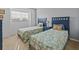 Bright bedroom with two twin beds, offering ample space and natural light at 204 Paloma Dr, Davenport, FL 33837