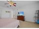 Bright bedroom featuring a TV and ample closet space at 204 Paloma Dr, Davenport, FL 33837